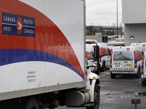 Canada Post vehicles at a distribution center in Montreal on May 23, 2025.