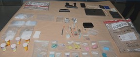 Durham Regional Police released this image of drugs and other evidence seized following an arrest in Newcastle.