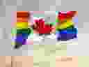 The Canadian flag with rainbow colours was tweeted by the federal government account.