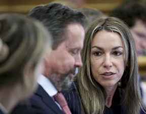 Karen Read speaks with her attorney Alan Jackson during her murder trial in Norfolk Superior Court in Dedham, Mass., Friday, May 30, 2025. (Mark Stockwell/The Sun Chronicle via AP, Pool)