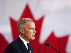Side view of Mark Carney with Canadian flag