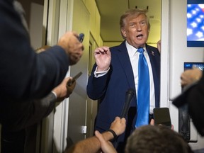 President Donald Trump speaks with reporters while flying aboard Air Force One en route from Calgary, Alta., to Joint Base Andrews, Md., late Monday, June 16, 2025.