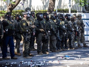 U.S. Border Patrol and protesters clash after a raid was conducted by Immigration and Customs Enforcement near a Home Depot store in Paramount, Calif., Saturday, June 7, 2025.