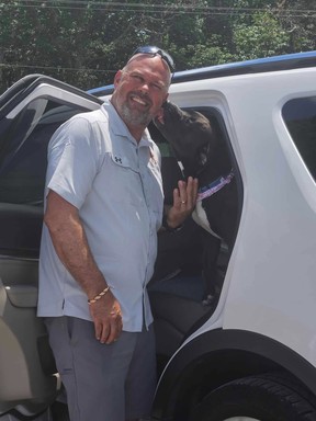Greg Sweeney picking up Sienna from the shelter