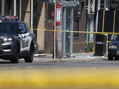 Police tape marks the spot where Karolina Huebner-Makurat was killed by gunfire across the street from the South Riverdale Community Centre. (Photo by Jack Boland, Toronto Sun, on July, 7, 2023.)