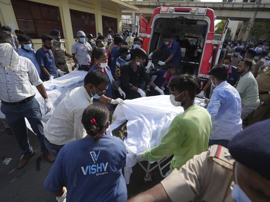 Remains of victims are brought to Civil Hospital after an airplane crashed in India's northwestern city of Ahmedabad in Gujarat state, Thursday, June 12, 2025.