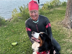 Walker, shown in September, pets dogs before and after the swimming portion of Ironman triathlons.
