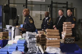 Peel Regional Police unveil the 479 kilos of cocaine, worth an estimated street value just below $50 million, that was seized during Project Pelican. Nine people were arrested and are related to commercial trucking businesses transporting the drugs across Canadian border crossing in Ambassador Bridge in Windsor and the Blue Water Bridge in Point Edward destined for Peel. Pictured, Peel Regional Police Chief Nish Duraiappah speaks to the reporters. JACK BOLAND/TORONTO SUN