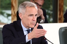 Canadian Prime Minister Mark Carney laughs during an Outreach Session at the Group of Seven (G7) Summit at the Pomeroy Kananaskis Mountain Lodge in Kananaskis, Alta., on June 17, 2025.