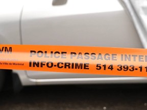 Police tape near a vehicle in Montreal.
