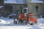 A City of Toronto plow and salt shaker clears sidewalks in the East York residential area on Ferris Road, east of Dawes Road, on Tuesday, January 25, 2022.