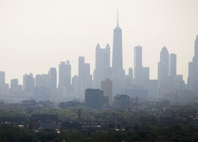 Smoke from Canadian wildfires envelope the downtown skyline in Chicago on June 3.