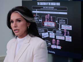 White House Director of National Intelligence Tulsi Gabbard talks to reporters.