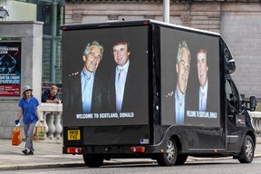 A photograph of U.S. President Donald Trump and convicted child sex offender Jeffery Epstein is displayed on the side of a van in Aberdeen city centre, north east Scotland on July 28, 2025.