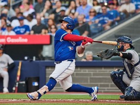 Toronto Blue Jays catcher Alejandro Kirk hits a two-run double.