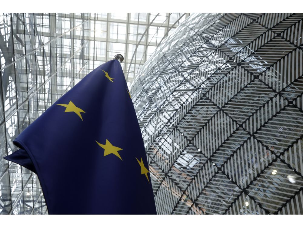 FILE - The European Union flag stands inside the atrium at the European Council building in Brussels, June 17, 2024.