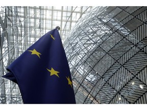 FILE - The European Union flag stands inside the atrium at the European Council building in Brussels, June 17, 2024.