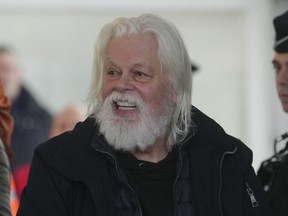 Environmental activist Paul Watson smiles as he arrives at Charles de Gaulle's airport in Roissy, north of Paris, Dec. 20, 2025 after being released from prison few days ago.