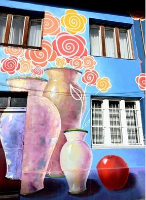 Old buildings renovated with murals in a city which still bears the physical scars of war three decades onELVIS BARUKCIC/AFP