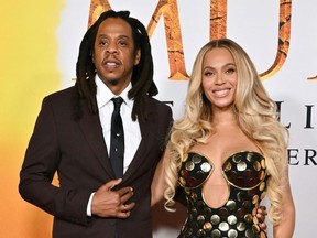 Beyonce, seen here with her rapper husband Jay-Z, also had her likeness used. (Lisa O’CONNOR/AFP)