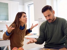 Displeased couple arguing about something at home.