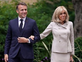 French President Emmanuel Macron and his wife Brigitte Macron arrive at Downing Street on July 9, 2025 in London, England.