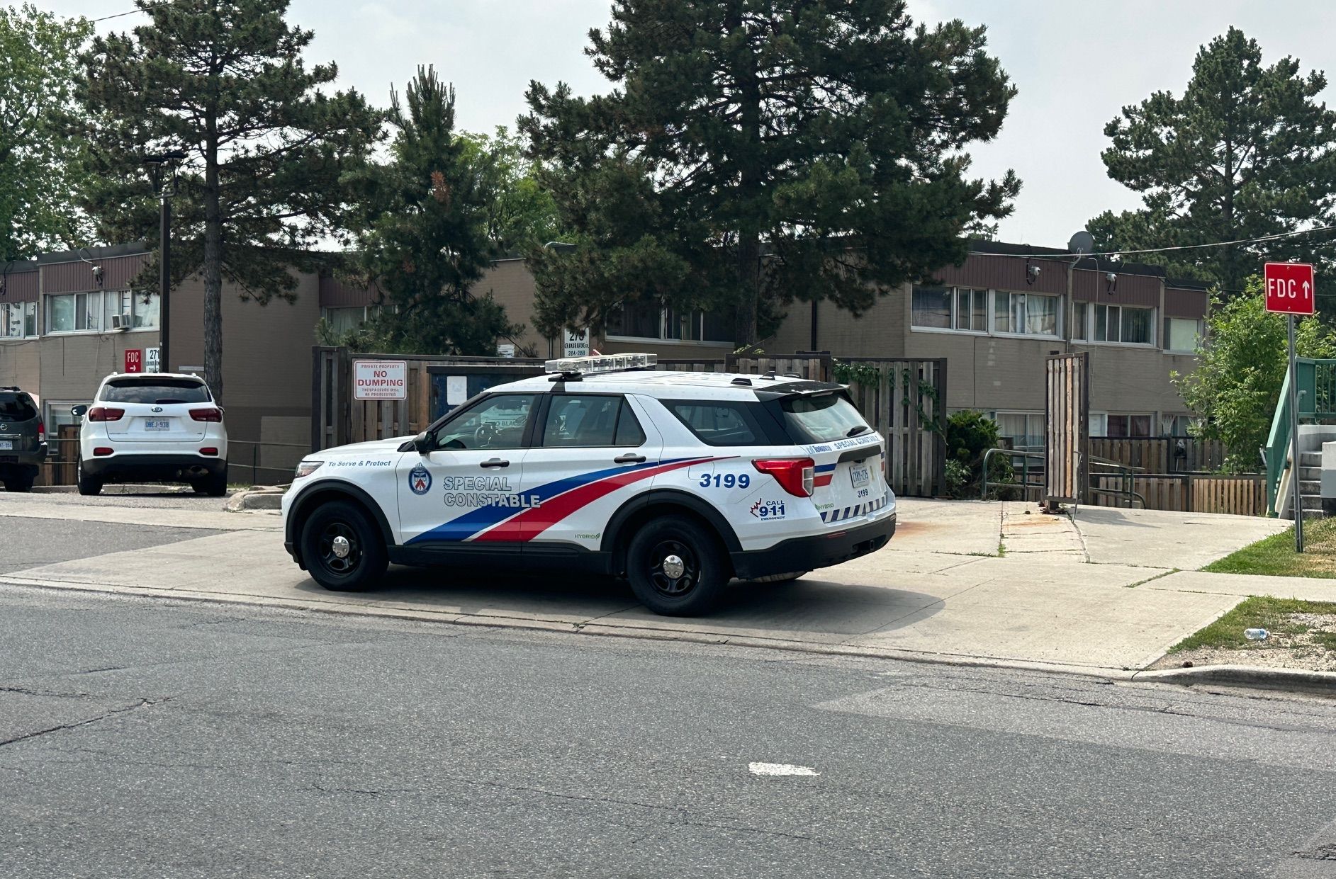 Toronto Police at the scene on Monday, July 14, 2025, the day after a woman was shot at Grandravine and Driftwood. 