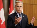 Canadian Prime Minister Mark Carney speaks during a press conference after a Cabinet meeting to discuss both trade negotiations with the US and the situation in the Middle East, at the National Press Theatre in Ottawa, Ontario, Canada on July 30, 2025.