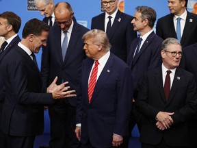 U.S. President Donald Trump speaks with NATO Secretary General Mark Rutte.