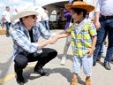 Pierre Poilievre greets people during a Stampede breakfast at the United Brotherhood of Carpenters and Joiners of America in Calgary on Saturday, July 5, 2025.