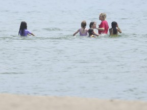 A group of young swimmers are seen in the water at Woodbine Beach in Toronto on July 9, 2024.