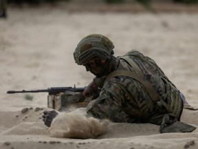 Nearly 10,000 men and women have volunteered for the month-long, paid ‘Vacation with the Army’ programme. (Wojtek RADWANSKI/AFP)