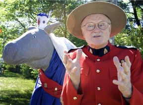 Dressed in his trademark Mountie costume, Canadian comedian Dave Broadfoot poses in front of Integracare nursing home's Florence Moosengale, RM (Registered Moose) in Toronto, Wednesday, May 25, 2005.