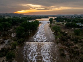 In an aerial view, the sun sets over the Guadalupe River on July 6, 2025 in Kerrville, Texas. Heavy rainfall caused severe flooding along the Guadalupe River in central Texas, leaving more than 80 people reported dead.