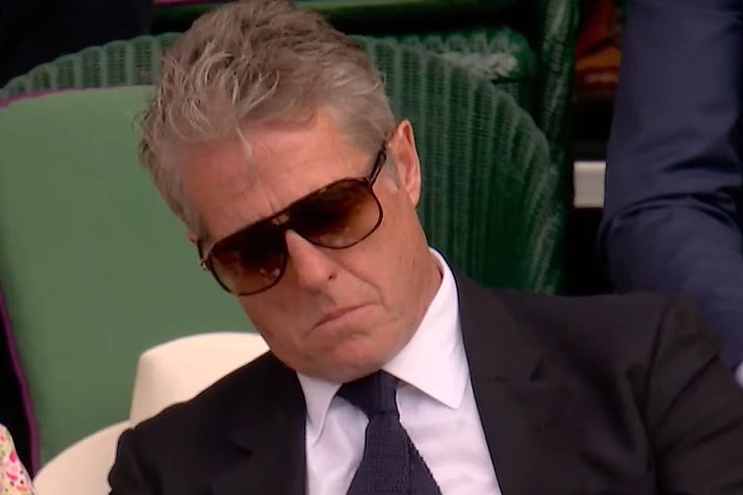 Tennis fans fume after Hugh Grant caught snoozing at Wimbledon