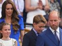 Prince William, right, Kate, Princess of Wales, rear, Prince George and Princess Charlotte arrive to watch Jannik Sinner of Italy and Carlos Alcaraz of Spain during their men's singles final match at the Wimbledon Tennis Championships in London, Sunday, July 13, 2025.