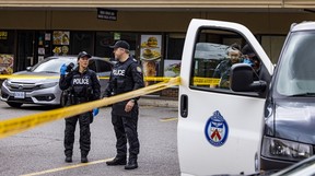 Toronto Police are seen in the parking lot at a shopping plaza on Parkway Forest Dr. in North York, which was the scene of a fatal stabbing on Thursday, July 17, 2025. ERNEST DOROSZUK/TORONTO SUN