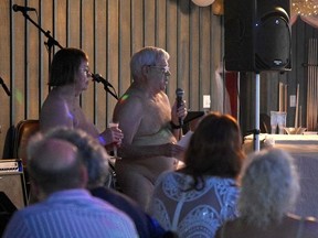 Avalon Resort founders Phyllis and Patrick Gaffney stand beneath a disco ball holding glasses of champagne as they toast and thank their early investors, employees and guests.