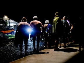 The Gaffneys head to their car in the rain as they leave the 30th anniversary gala.
