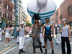 Myles Sexton, second from left, and guests participate in the 2025 Toronto Pride Parade on June 29, 2025 in Toronto.