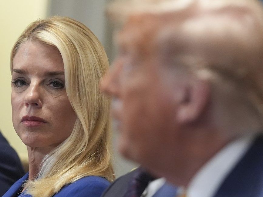 Attorney General Pam Bondi, left, listens as President Donald Trump, right, speaks during a cabinet meeting at the White House, Tuesday, July 8, 2025, in Washington.