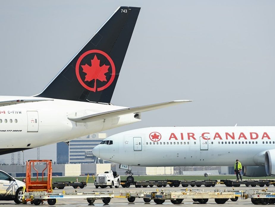 Air Canada planes sit on the tarmac at Pearson International Airport in Toronto on Wednesday, April 28, 2021.  
