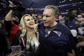 New England Patriots head coach Bill Belichick celebrates with his girlfriend Linda Holliday after the NFL Super Bowl 53 football game against the Los Angeles Rams, Sunday, Feb. 3, 2019, in Atlanta. The Patriots won 13-3. (AP Photo/Matt Rourke)