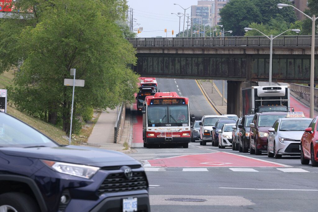A dedicated red bus lane is seen on Eglinton Ave. E. at Bellamy Rd. N. in Scarborough on Wednesday August 6, 2025. The concept is coming to Bathurst and Dufferin Sts. as part of city hall’s RapidTO initiative.