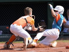 Boerne, Texas catcher Doc Mogford tags out Venezuela's Santiago Bello as he attempted to score during a Little League World Series game in 2024.