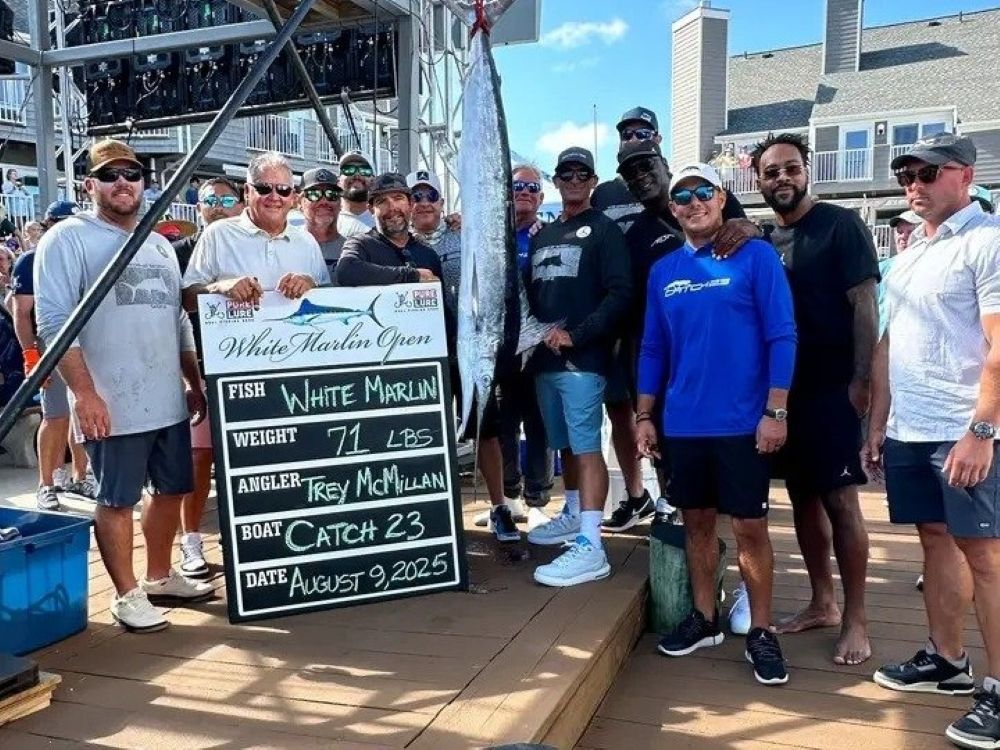NBA legend Michael Jordan (fourth from right) celebrates with his Catch 23 team at the White Marlin Open.