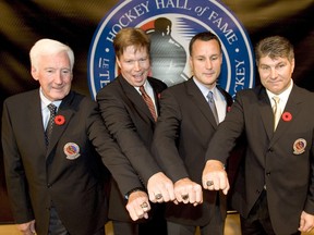 From left. Cliff Fletcher, Larry Murphy, Paul Coffey and Raymond Bourque show off their hockey hall of fame rings.