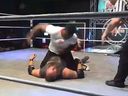Raja Jackson lands punches to the head and face of professional wrestler Syko Stu.