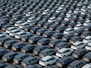 This photo taken on April 18, 2024 shows BYD electric cars for export waiting to be loaded onto a ship at a port in Yantai, in eastern China's Shandong province.