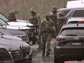 Australian police say their priority is to catch a gunman accused of killing two officers.